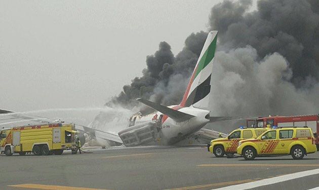  Smoke billowing from an Emirates plane that caught fire at Dubai Airport.